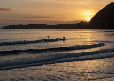 gc74 Sidmouth, surfing at sunset, Devon,